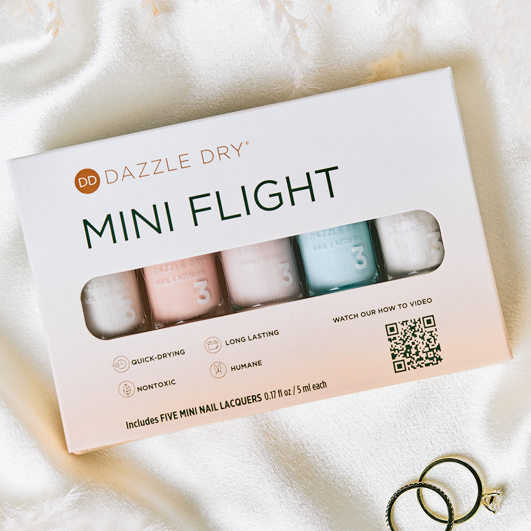 I Do Mini Flight - Dazzle Dry nail lacquers next to rings