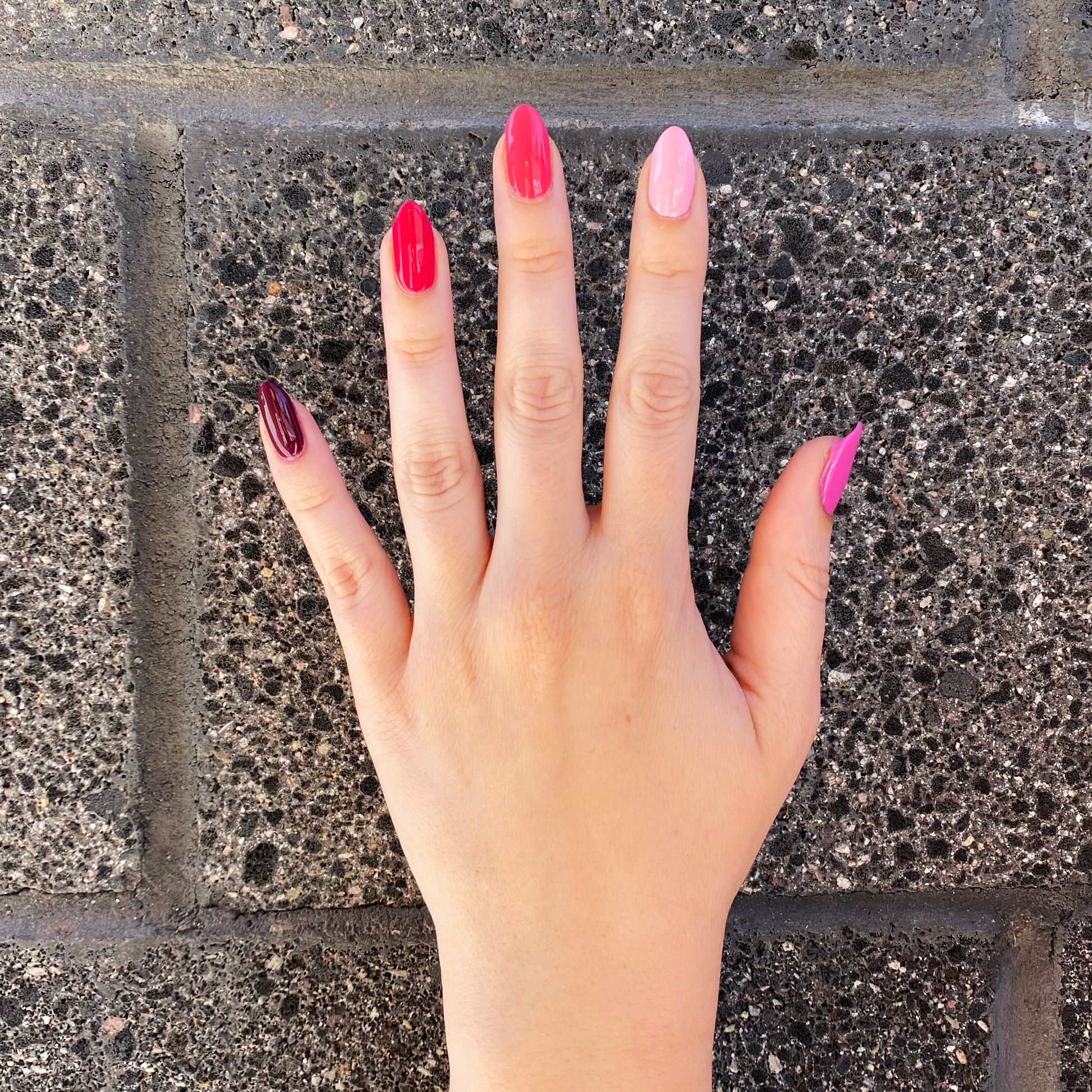 Hand with Coronado Mini Flight shades painted on nails