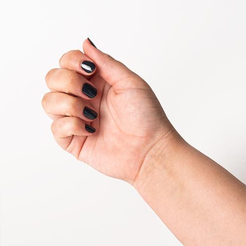 Hand with Joan's Armor painted on nails