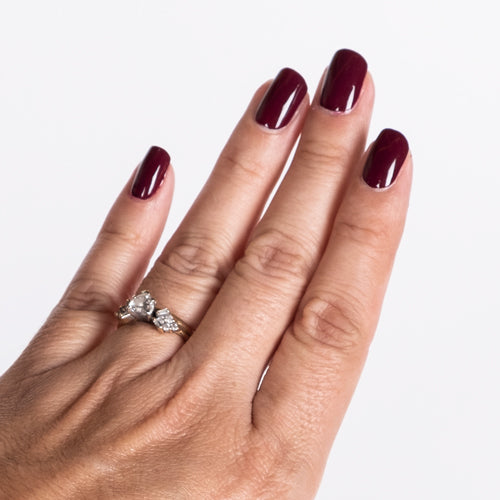Hand with Red Rouge painted on nails
