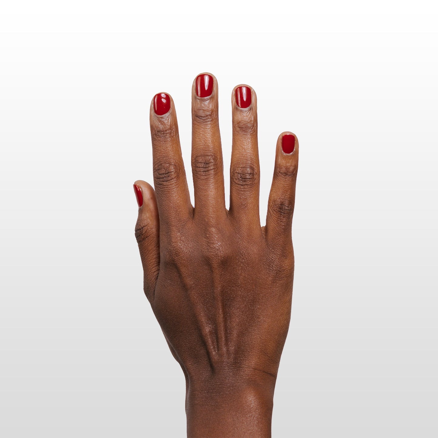 Hand with Ember painted on nails