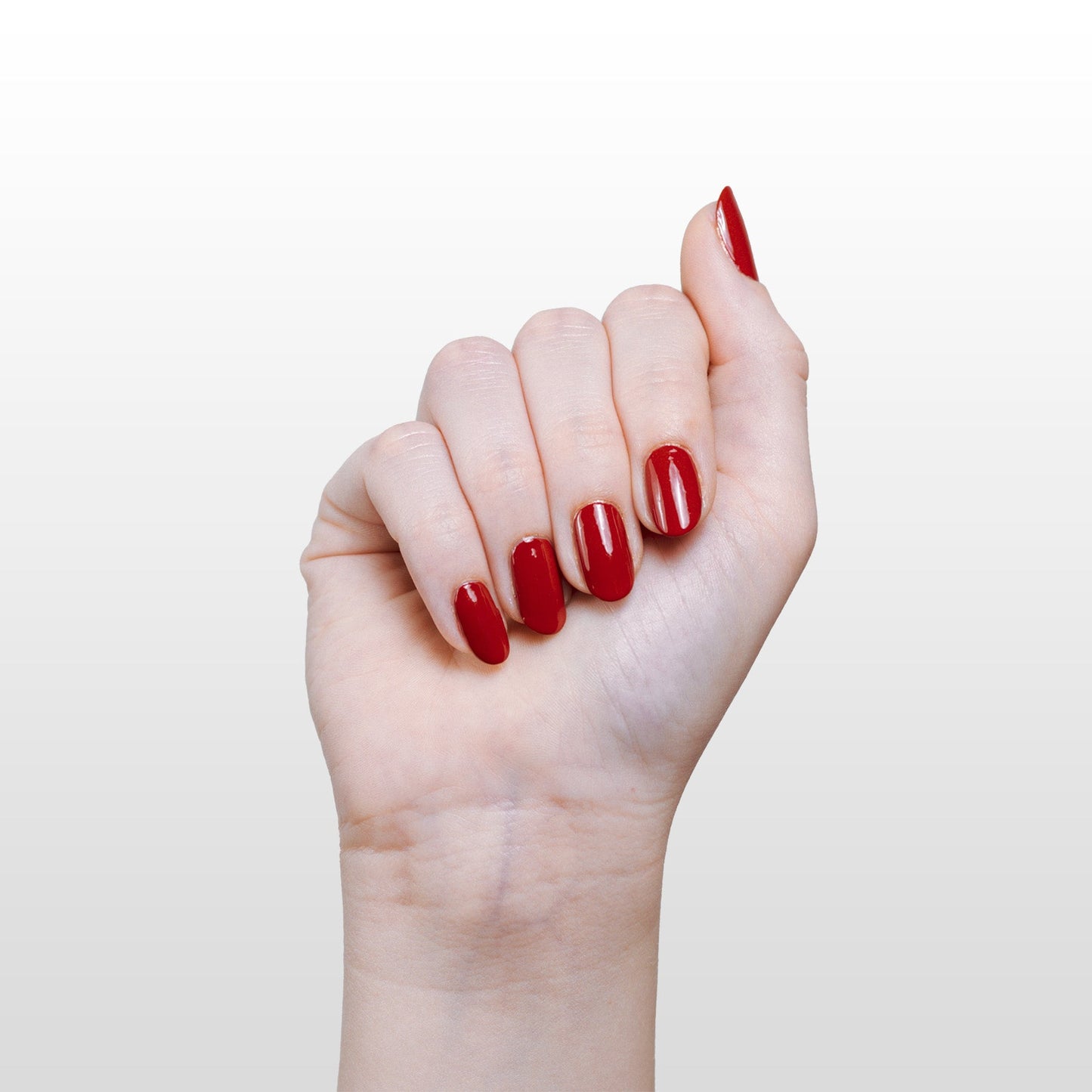 Hand with Ember painted on nails