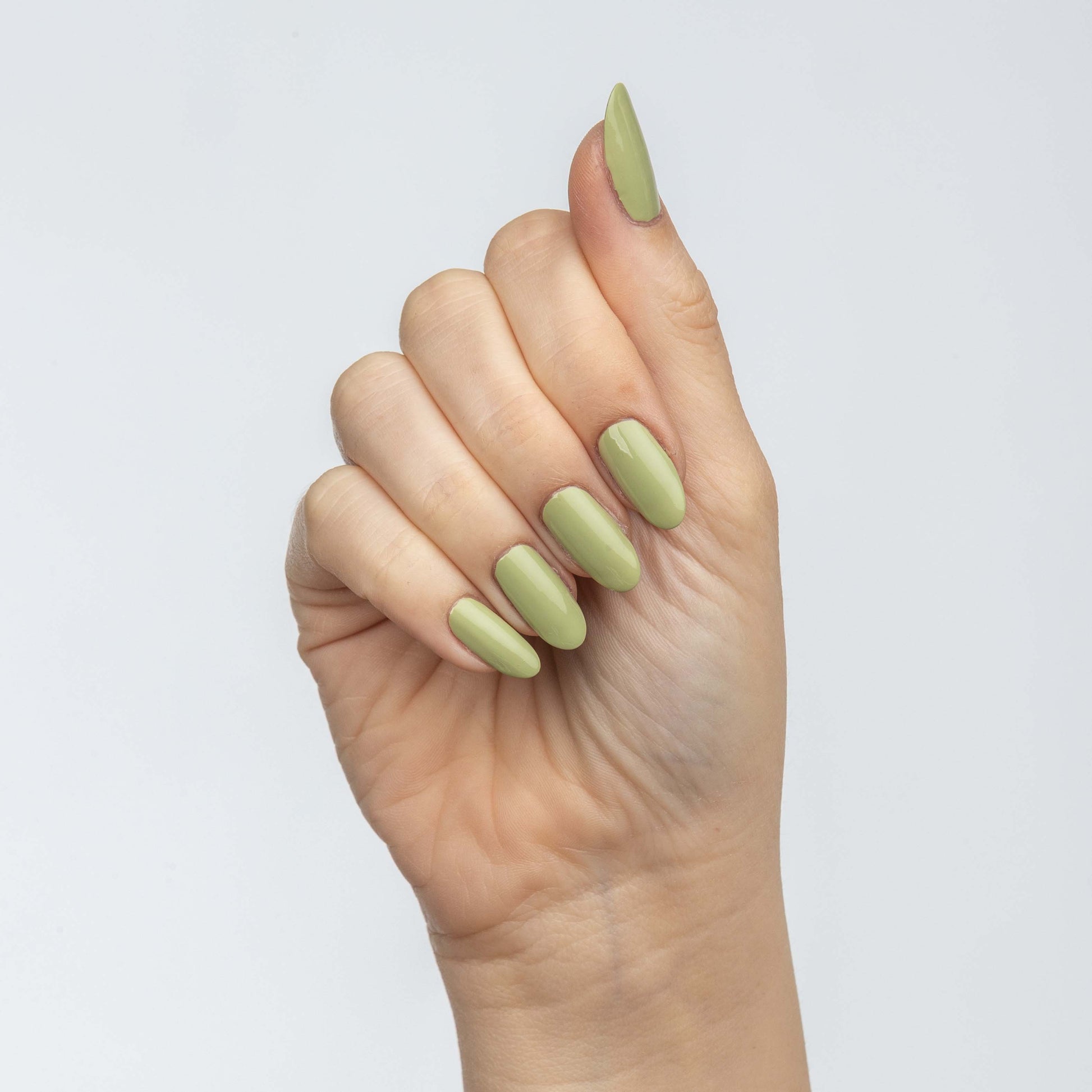 Hand with Pistachio painted on nails