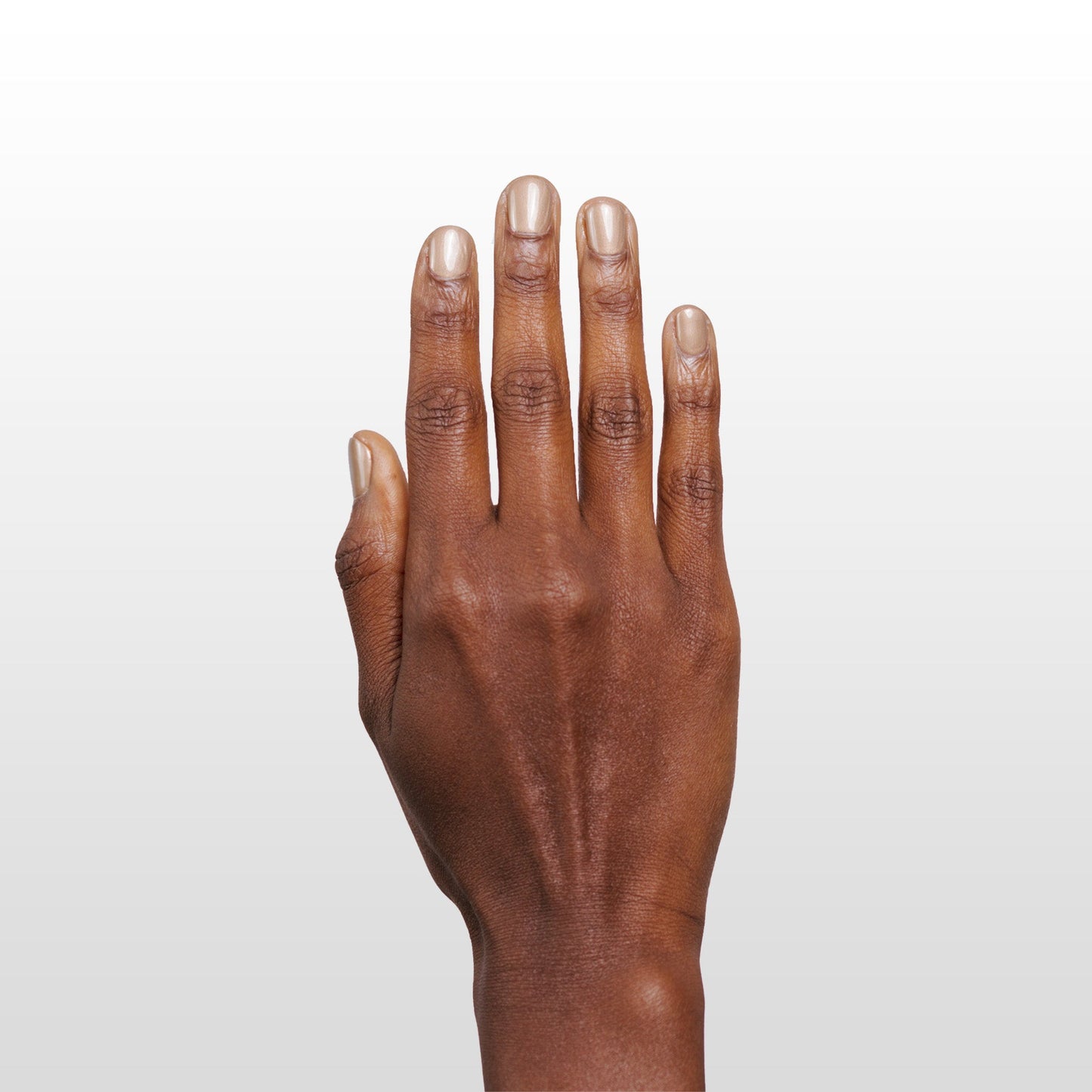 Hand with Shimmering Sands painted on nails
